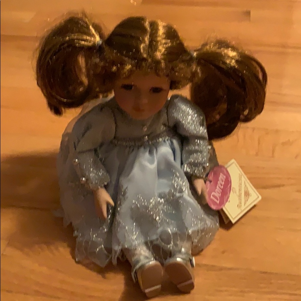 Musical porcelain doll